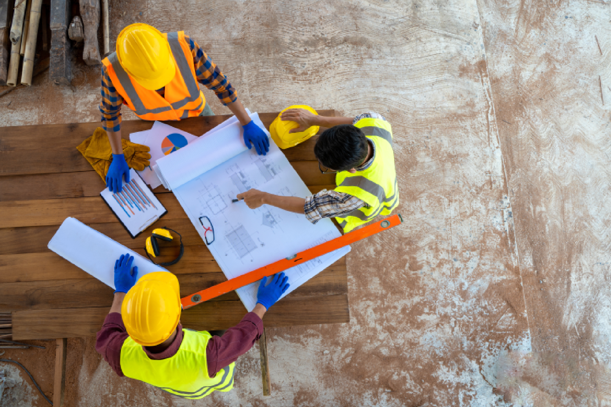 Construction engineers discussing a map